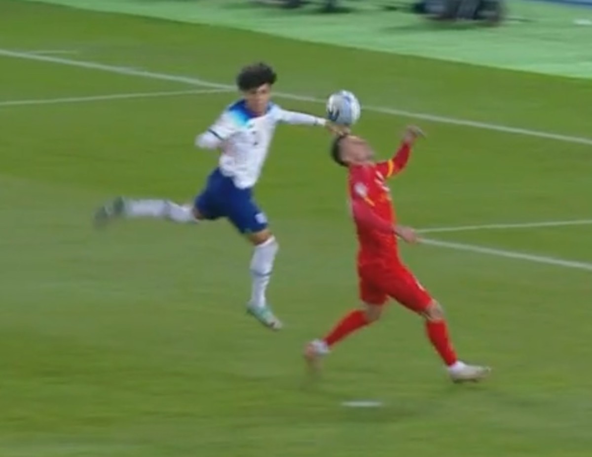 Rico Lewis (left) pictured moments after he apparently fouled Bojan Miovski during England's Euro 2024 qualifiers against North Macedonia in November 2023